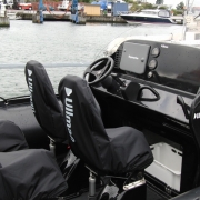 Aerodynamic boat console with windshield